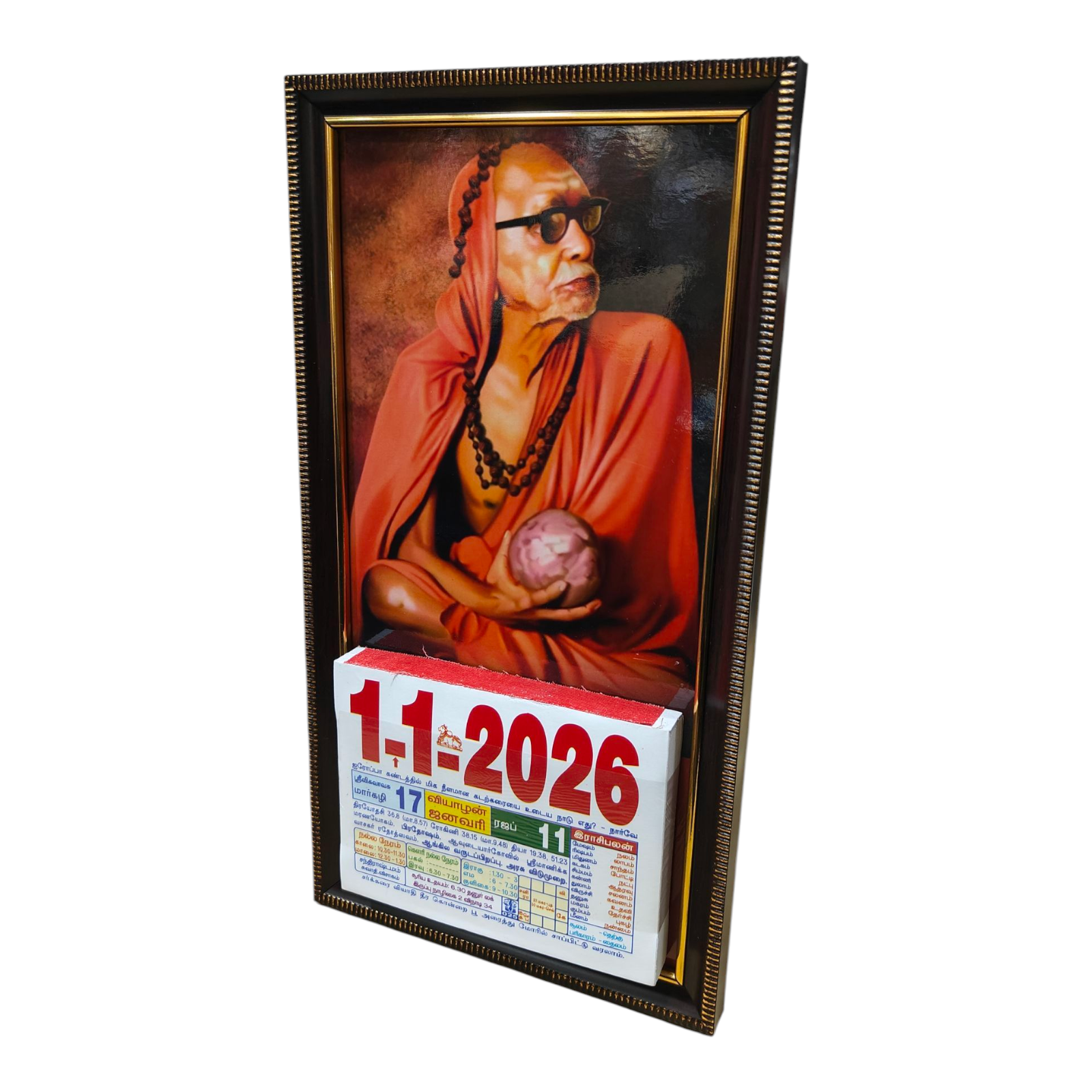 Kanchi Mahan holding Dry Coconut Colourful Daily Sheet Calendar 2026